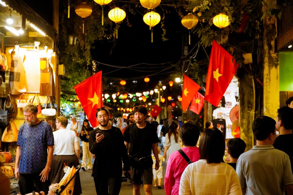 Traveler walking through Hoi An Ancient Town in central Vietnam 
