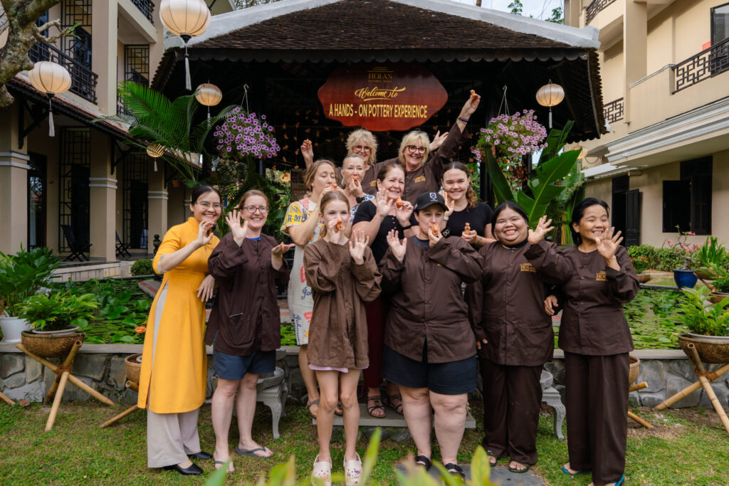 Tourists experience pottery-making activities at Hoi An Historic Hotel.